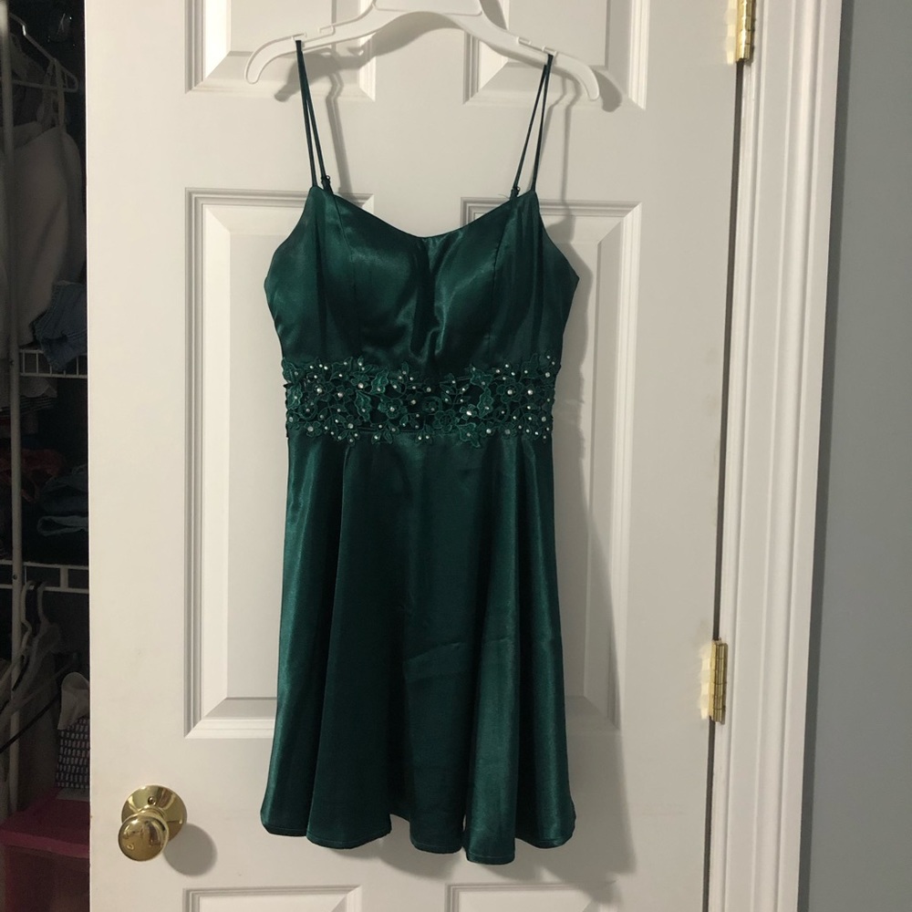 emerald green formal dress with flower detailing